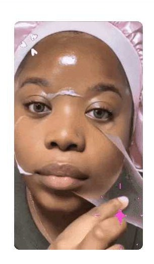 Woman applying the collagen night wrapping mask to her face