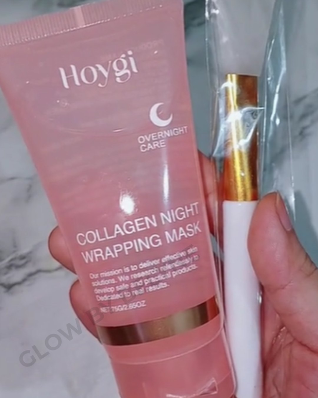 Holding the collagen night wrapping mask tube